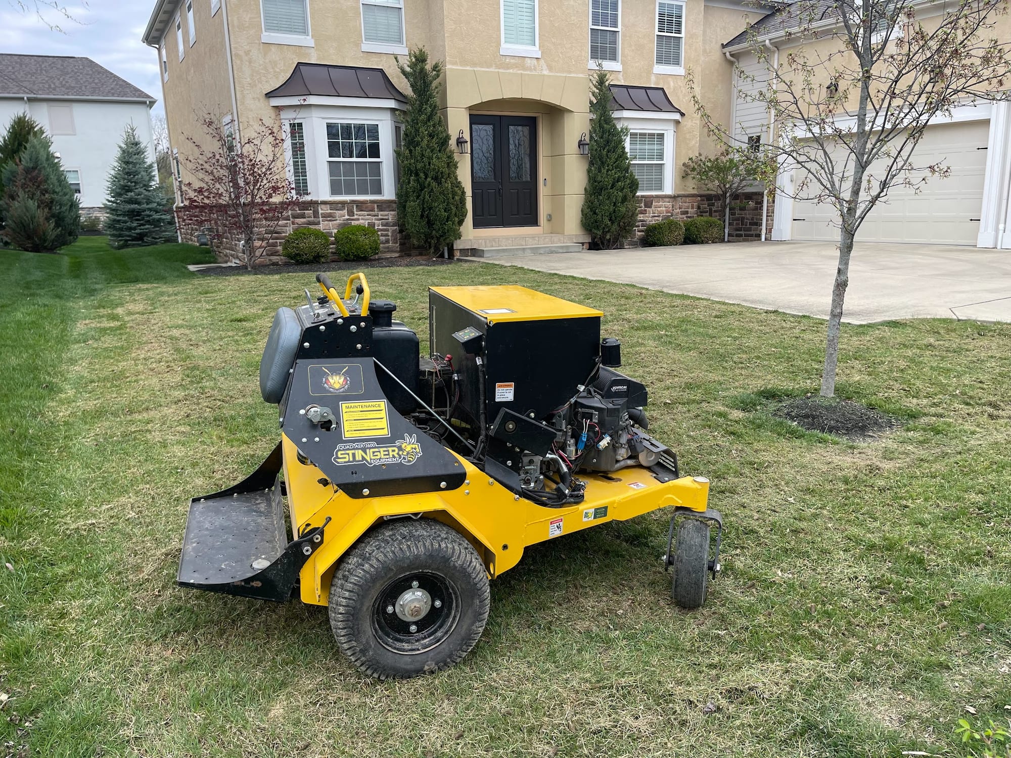Core aerator working across a lawn