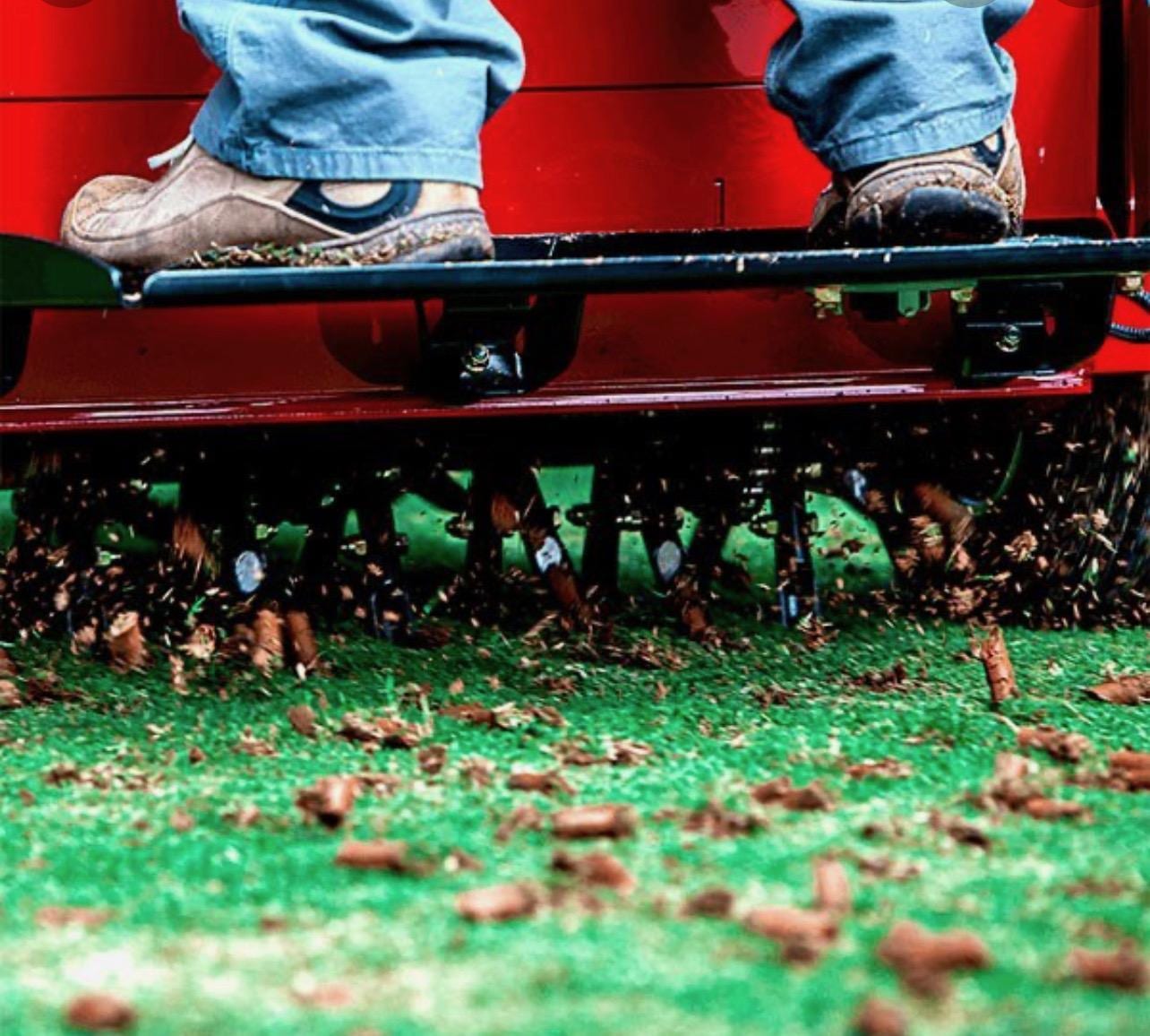 Aerator tines pulling plugs, up close