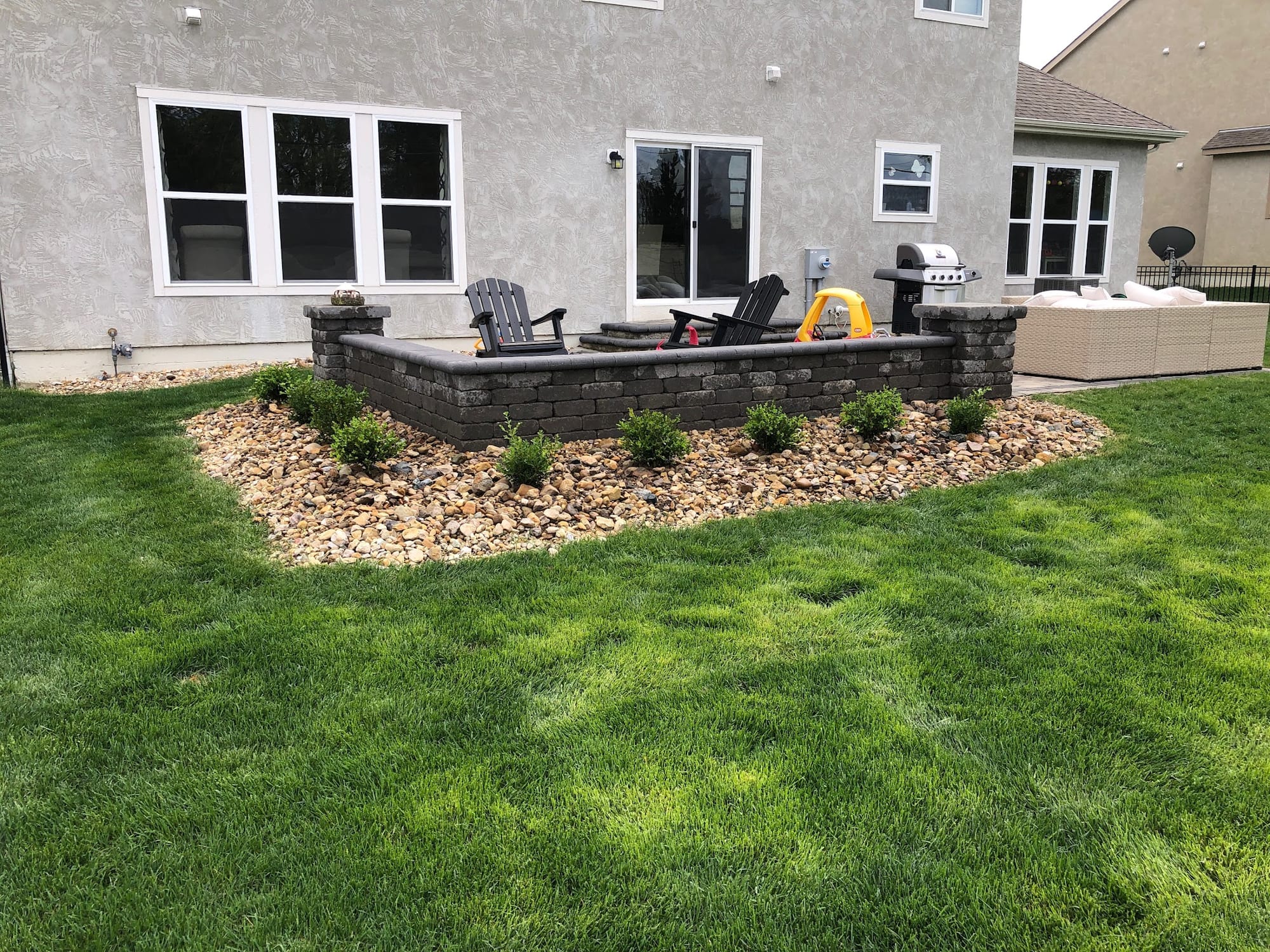 Paver patio with seating wall and fire feature